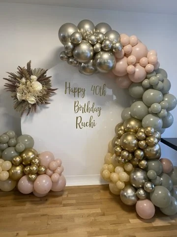 Sage, blush and chrome arch with a personalised sign